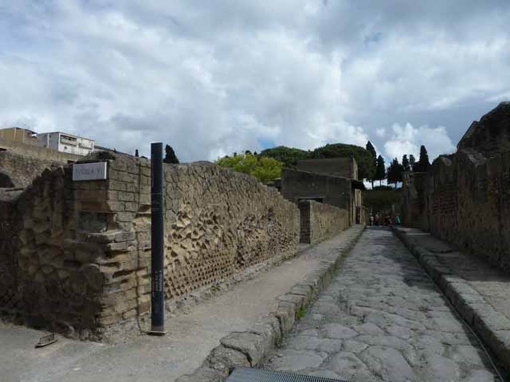 Decumanus inferiore, looking east along north side of Ins. VI, at its south-west corner, towards VI.4. May 2010.